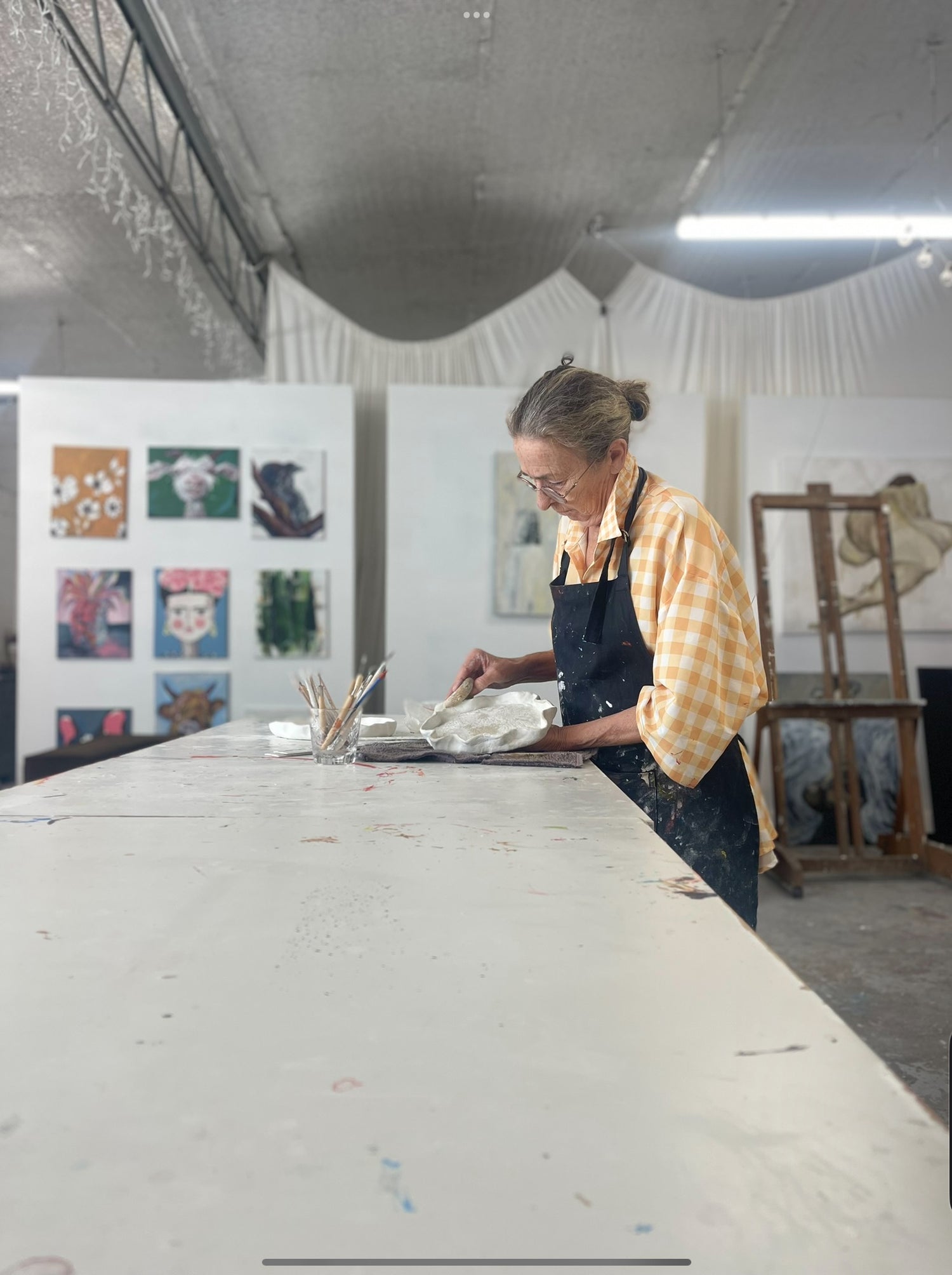 Artist Maree Quinn working with clay at the sweet fine artist studio mermaid beach Gold Coast