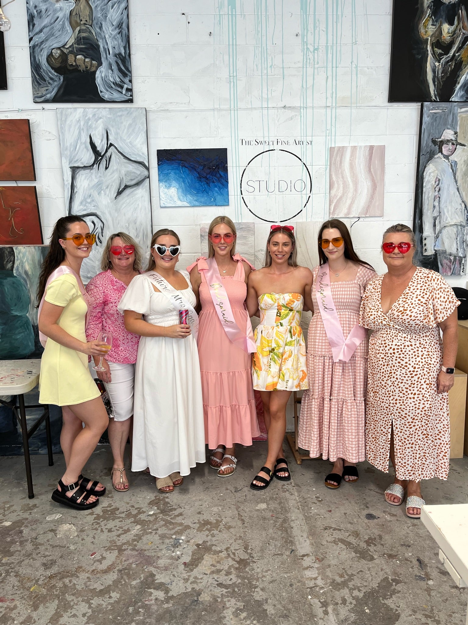 Hens part ladies event group of bridal shower guests in art studio