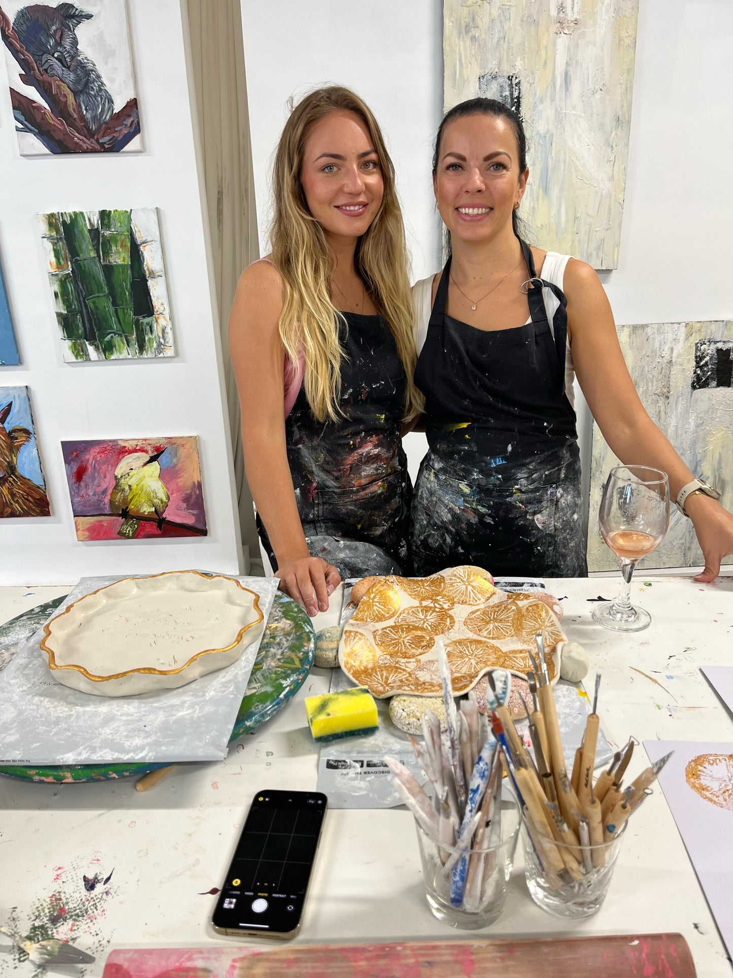 Two young women having fun during a clay & sip event at the sweet fine artist studio mermaid beach gold coast